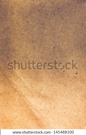 Textured recycled vintage smokey brown paper gradient color. Useful as background.