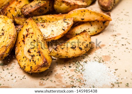 A pile of french fries potato wedges in country styled.  Fast food. Closeup.