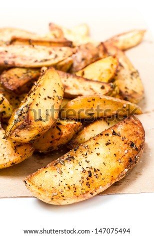 Fried potato wedges country styled.  Fast food.  Macro.