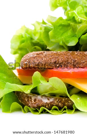 Fresh  sandwich with rye wholemeal bread,  cheese and vegetables isolated on white background