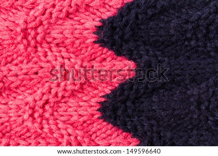 Colorful knitting background texture, two colors. Knit woolen Fabric textile multicolor back. Red and dark blue color.