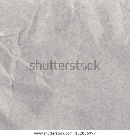 Crumpled textured natural gray  recycled paper  texture or background. Vintage craft paper texture. Paper for package.