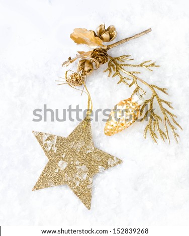 Christmas card with golden star and decorations on snow   lights background