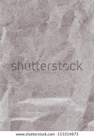 Recycled crumpled gray paper sheet texture or background with Torn edge. Old craft paper texture.