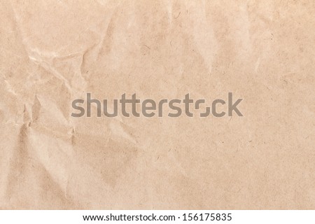 Crumpled recycled paper  texture or background. High resolution recycled brown cardstock with halftone
