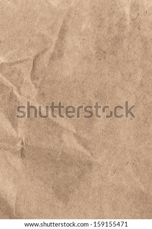 Crumpled  recycled paper  background texture. Vintage craft paper texture brown color. Paper for package.