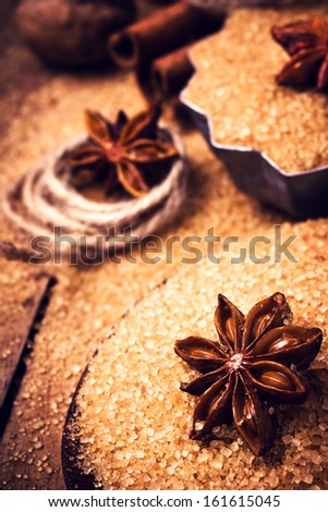 Cinnamon sticks and star anise on brown sugar