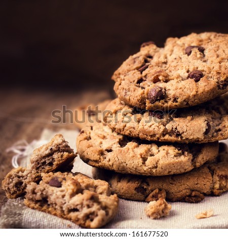 Stack Of Chocolate Chip Cookies On Wooden Background. Stacked Chocolate Chip Cookies Shot With Selective Focus.