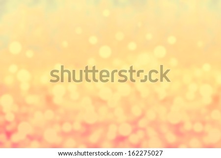 Glittery lights golden abstract Christmas background. Defocused Bokeh twinkling lights Vintage background.