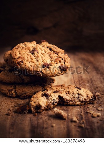 Pile of Chocolate chip cookies  on wooden table. Stacked chocolate chip cookies  in country style.