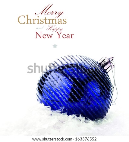 Christmas decoration with  big blue bauble and snow  (with easy removable sample text)