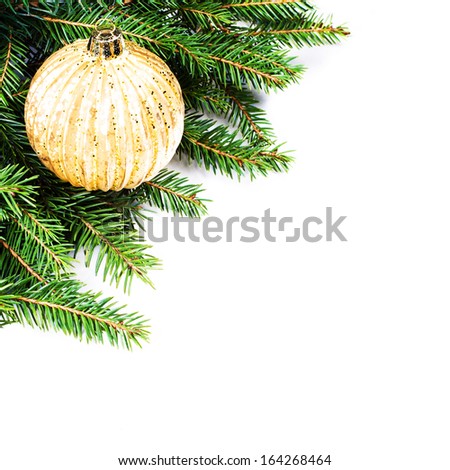 Christmas Fir Tree Border with  festive ornaments isolated on white background with copy space for text. Christmas tree branches border over white.