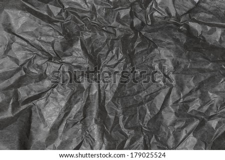 Crumpled  paper background texture. Vintage craft paper texture dark grey color. Background of kraft package Paper.