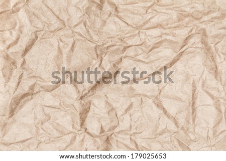 Crumpled recycled paper background texture. Vintage craft paper texture bright brown  color. Paper for package.