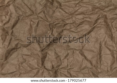 Crumpled recycled paper background texture. Vintage craft paper texture dark brown  color. Paper for package.