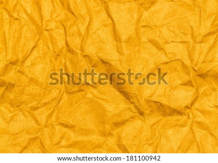 Crumpled yellow paper texture background. Craft paper sheet, vivid color. Texture of crumpled paper.