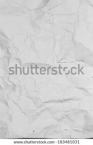 Crumpled grey paper background. Old gray paper texture as abstract grunge background. Grey paper sheet.