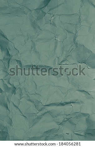Recycled paper texture closeup background. Crumpled  dark green colored  paper texture background.