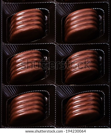 Box of chocolate truffles, close-up, chocolate gift. Various chocolates as a background