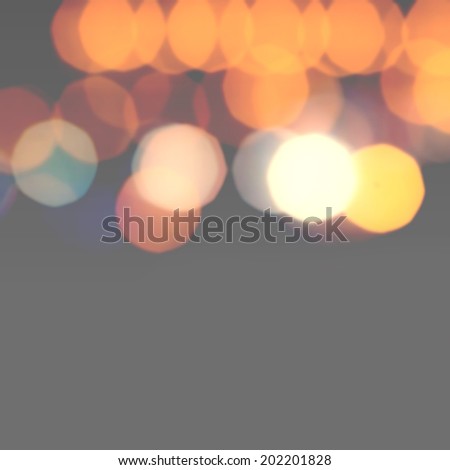 Night Abstract Defocused Bokeh light vintage background. Soft light abstract background with golden lights.