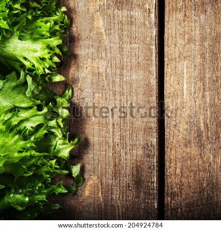 Bunch of Fitness Salad on wooden background.  Diet Food and healthy lifestyle concept. Lettuce Salad background with copyspace.