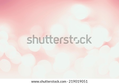 White Natural Defocused Bokeh lights on a soft pink gradient background, festive backdrop