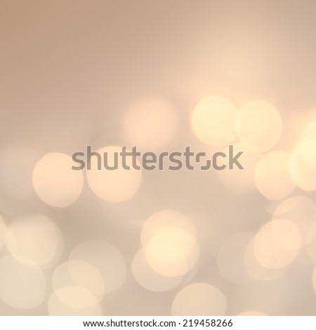 Soft light abstract background. Defocused Bokeh twinkling lights Vintage background.  Festive blur background with natural bokeh and bright golden lights.