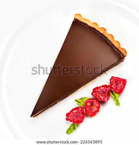 Chocolate cheesecake with raspberries. Dark chocolate cake with chocolate sauce macro