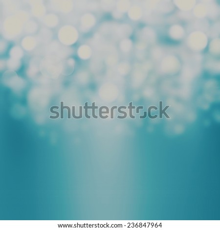 Sparkling Lights Festive background with texture. Abstract Christmas twinkled bright background with bokeh defocused silver and blue white  lights