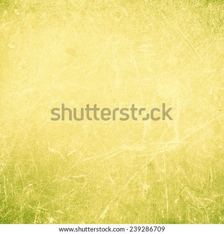 Grunge Abstract yellow  textured  background with spotlight and scratches. Yellow grunge wall closeup for design. Grungy  backdrop.