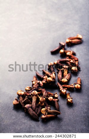 Spice background - various spices over dark table. Collection of different spices. Food backdrop