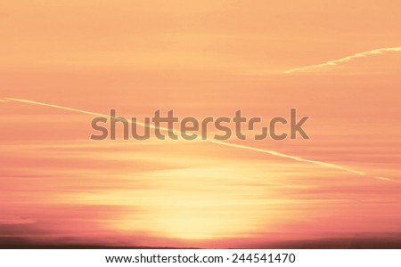 Beautiful nature background - red sunset, bright sun. Scenic view of beautiful sunset above the city.
