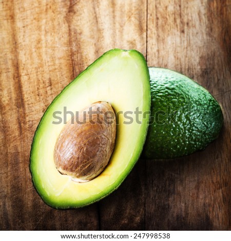 A sliced avocado on a cutting board closeup. fresh ,green avocado