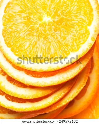 Slices of fresh orange fruit  isolated on white background closeup. Stack of orange slices