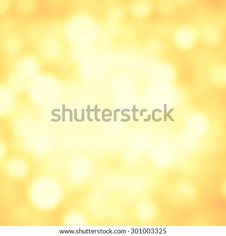 Abstract Festive background. Glitter vintage lights background with gold and white lights, defocused. Christmas and New Year feast bokeh background with copyspace.