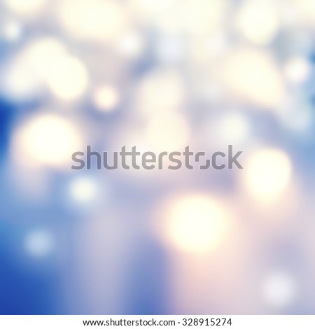 Defocused Bokeh twinkling lights - Glitter Abstract circular bokeh background of Christmas light. Blue, golden and white Vintage background.