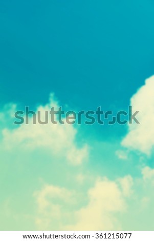 Blue sky, clouds and sun light background vintage toned. Retro filter