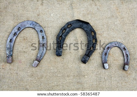 Three new horseshoes on a sacking