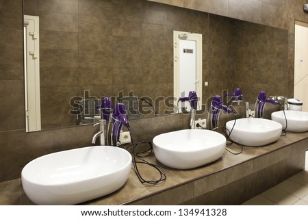 sinks and  hairdryers at locker room
