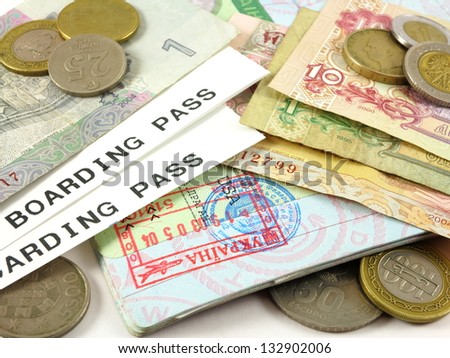 Visa stamp, boarding passes, foreign currency and coins