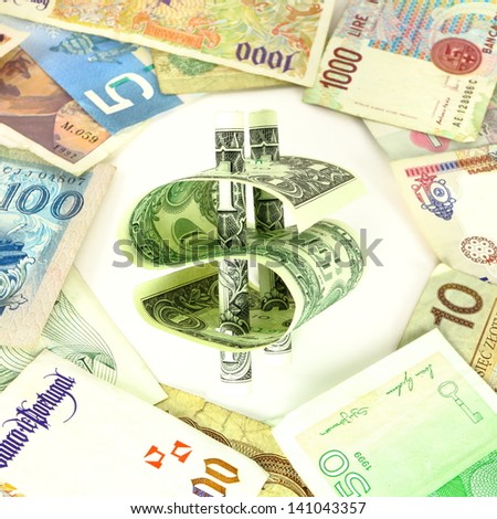 Isolated dollar bill symbol among multiple foreign currency