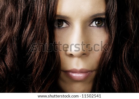 Portrait of a mysterious female with huge hair volume