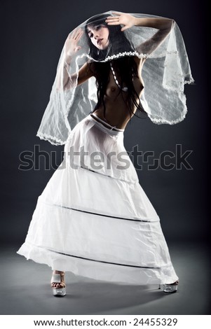 stock photo Seminude high fashion bride in creative wedding dress