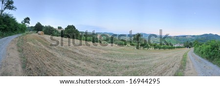 200Â° panorama of hillside country scene with dirt road, field and farm house in Italian Appennini very high resolution