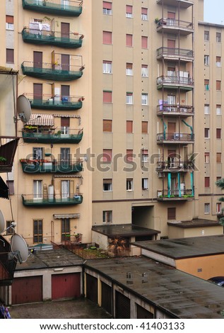Back side and yard of apartment buildings in Brescia, Italy in a rainy day