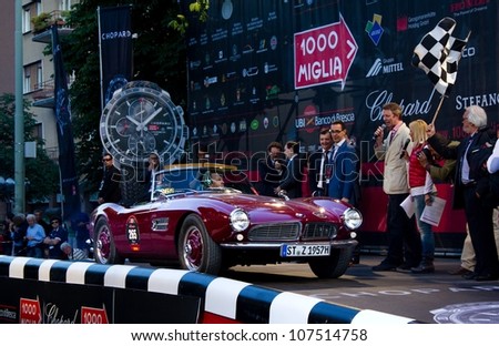 BRESCIA ITALY - MAY 17: Red 1957 BMW 507 driven by M. Feldhaus starts the 1000 Miglia 2012, on May 17, 2012 in Brescia
