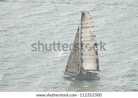 TIGNALE (BS) ITALY - SEPTEMBER 8: Two Asso 99 boats (Assterisco, skipper Omboni and Lo Zio Ke Asso, Picotti) sail close to the wind at Centomiglia 2012 regatta, on September 8, 2012 in Tignale (BS)