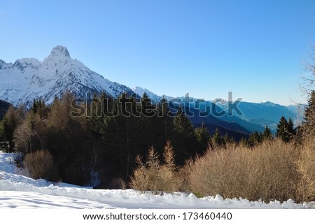 winter landscape in Val Camonica, with Pizzo Badile north face
