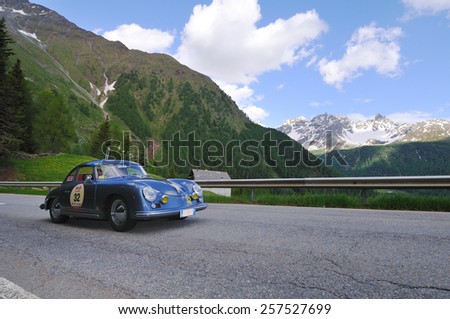 VAL DI POSCHIAVO, SWITZERLAND - JUNE 13: A blue Porsche 356 A T1 takes part to the Summer Marathon classic car race on June 13, 2014 in Val di Poschiavo. This car was built in 1956