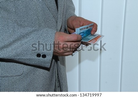 man holding money in hand